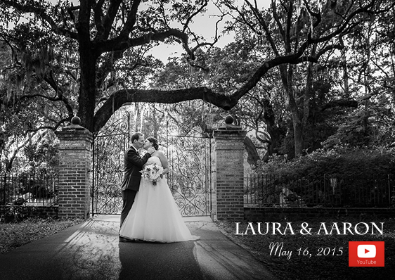 Bride and groom kiss under Live Oak trees in front of wrought iron gate at LeGare Waring house, Best Charleston fine-art photographer Reese Allen